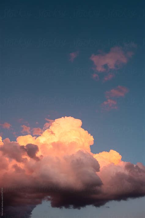 "Cumulus Clouds At Sunset" by Stocksy Contributor "Vera Lair" - Stocksy