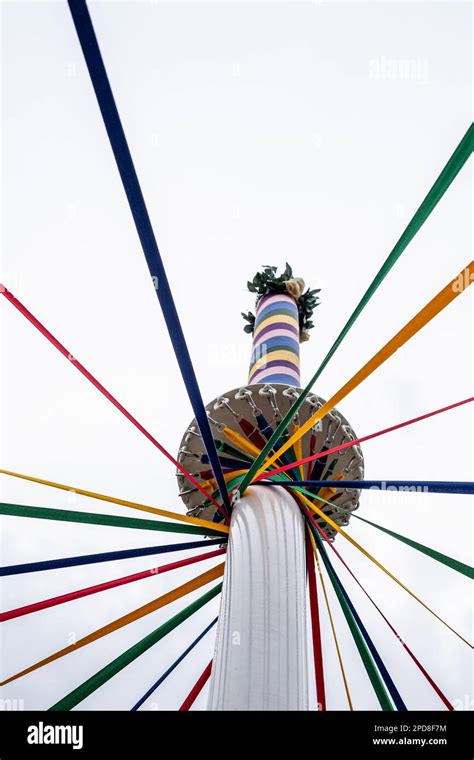 Brightly coloured ribbons of a traditional English maypole used for ...