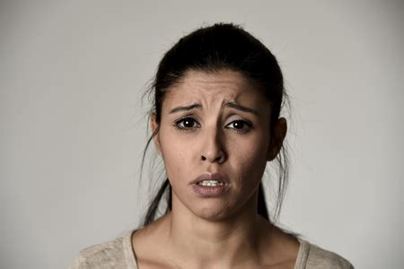 young beautiful hispanic sad woman serious and concerned looking ...