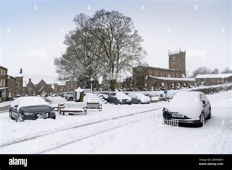 Weather, Askrigg, North Yorkshire, UK, 2 Feb 2021. St Oswalds Church in Askrigg, where the ...