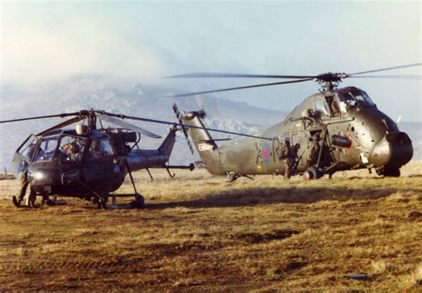 Soldiers of 3 PARA board a Westland Wessex parked next to a Westland Scout, on their way to Mt ...