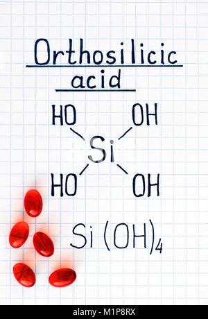 Chemical formula of Silicic acid with red pills. Close-up Stock Photo - Alamy