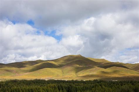 Dramatic Mountain Under Cloudy Sky with Grasslands on Tibetan Plateau Stock Image - Image of ...