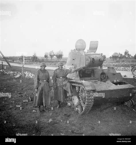 Soldiers of the 61st Infantry Division at a Russian tank T-26 shot down ...