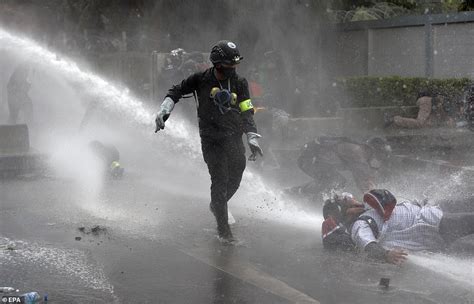 Thai cops fire water cannons at anti-monarchy protesters during demonstration | Daily Mail Online