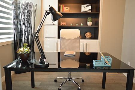 Royalty-Free photo: White and black wooden 6-drawer knee-hole desk with blue rolling chair | PickPik