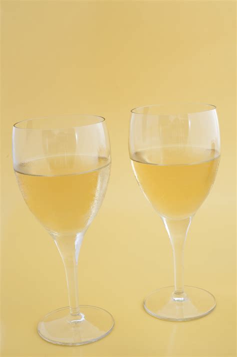Free Stock Photo 10470 Two glasses of white wine ready for celebration | freeimageslive