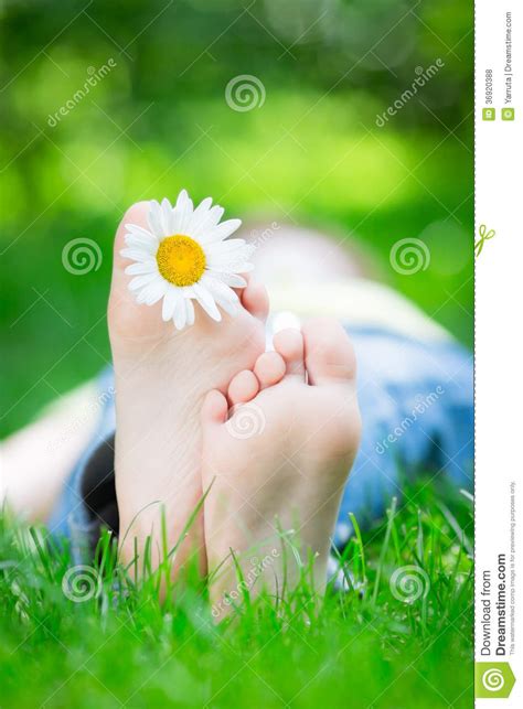 Kid lying on grass stock photo. Image of lifestyle, flower - 36920388