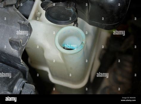 Car radiator system Maintenance of opening the radiator cap Car cooling system Stock Photo - Alamy