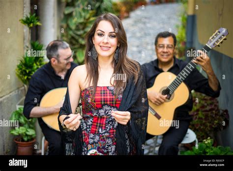 Fado band performing traditional portuguese music on the street of Alfama, Lisbon, Portugal ...