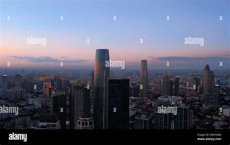 An aerial view of TianJin skyline on pinkish-blue sunset sky background ...