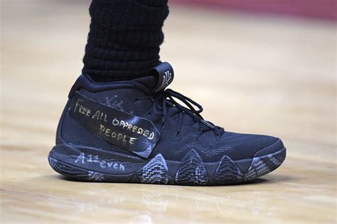 Brooklyn Nets guard Kyrie Irving (11) wore a shoe with the words \”Free ...