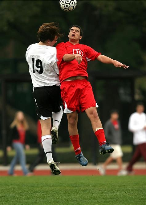 People Playing Soccer on Soccer Field during Daytime · Free Stock Photo