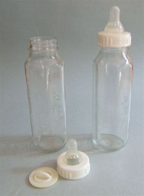 2 Vintage Glass Evenflo Baby Bottles