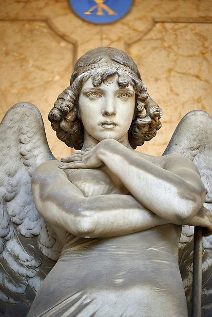 Picture and image of the stone sculpture of an enigmatic angels face in a realistic style. One ...