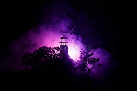 Lighthouse with Light Beam at Night with Fog. Old Lighthouse Standing ...