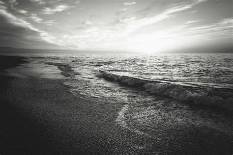 Grayscale Photo of Bicycle Beside Seashore · Free Stock Photo