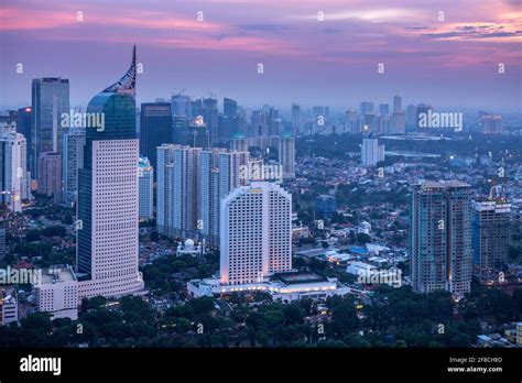 The illuminated skyline of downtown Jakarta - capital city of Indonesia, showing the Central ...