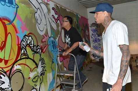 Chris Brown + Graffiti Artist Slick Team Up to Create Artwork Pieces for Charity