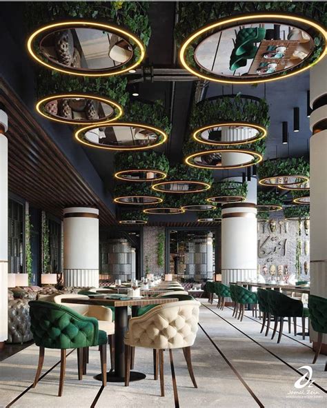 the interior of a restaurant with green velvet chairs and round ...