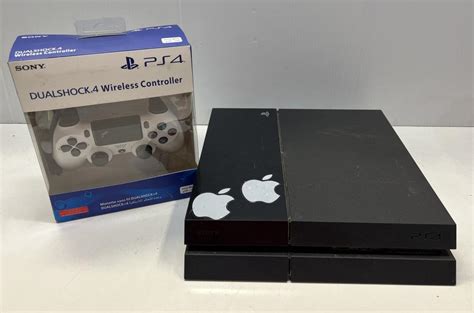 Lot - A used gaming console marked PS4 and unused wireless controller