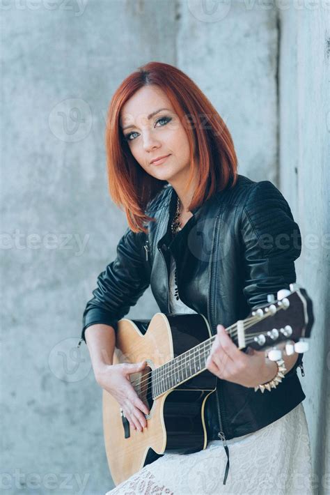 young girl with red hair with an acoustic guitar 2377164 Stock Photo at ...