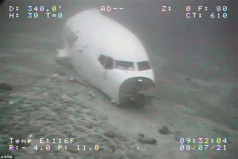 Haunting photos show underwater wreckage of Boeing cargo plane that made emergency ditch landing ...