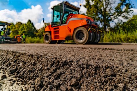 Premium Photo | Roller at asphalt pavement works roller during road ...