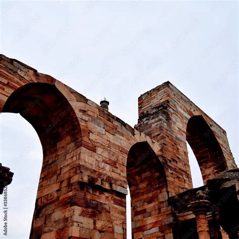 Inside the Qutub Minar Complex with antic ruins and inner square ...