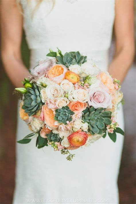 Peach roses and succulents are beautifully paired up in this bridal ...