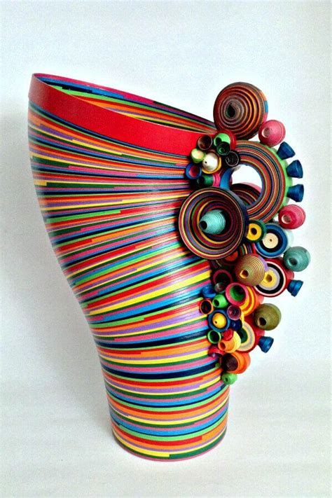 A vibrant rolled paper sculpture vase by Coleccion Serpentina is ...