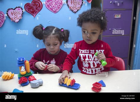 Diverse children playing in classroom hi-res stock photography and images - Alamy