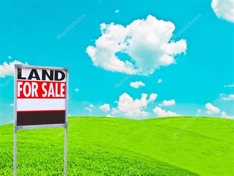 "LAND FOR SALE SIGN" on empty meadow - Real estate conceptual im Stock Photo by ©Alexis84 9724173