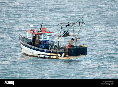 small fishing boat trawling Stock Photo - Alamy