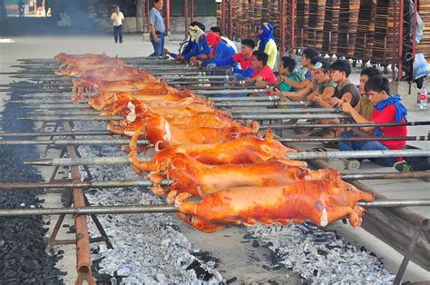 LECHON | This is how we cook roasted pig. It was skewed with… | Flickr