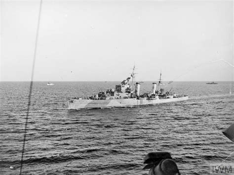 His Majesty's Heavy Cruiser Exeter — HMS Sirius as seen from HMS Howe, September 1943....