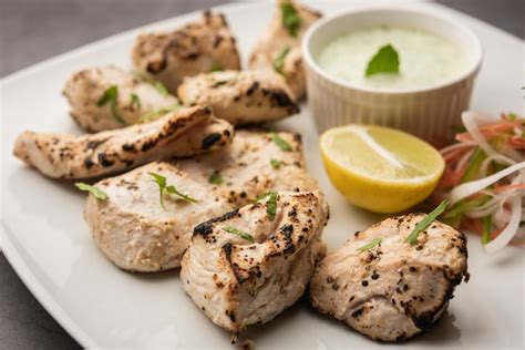 Premium Photo | Indian afghani chicken malai tikka is a grilled murgh ...