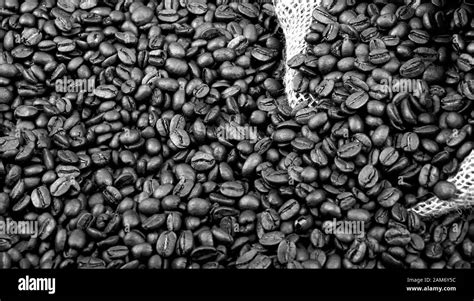 Rich coffee beans background image Stock Photo - Alamy