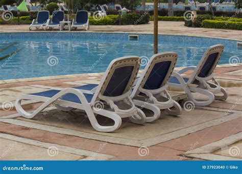 Swimming Pool Lounge Chairs Stock Photo - Image of hospitality ...