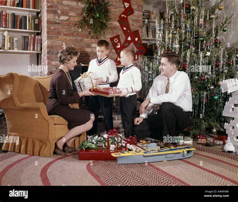 1960 1960s RETRO FAMILY CHRISTMAS GIFTS Stock Photo - Alamy