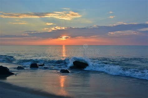 Beautiful Beach Sunrise with Golden Skies Stock Photo - Image of blue, coastline: 78687392