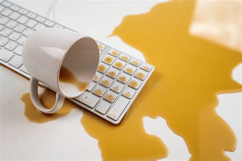 Spilled Cup of Black Coffee on Computer Keyboard on White Table. Stock Image - Image of white ...