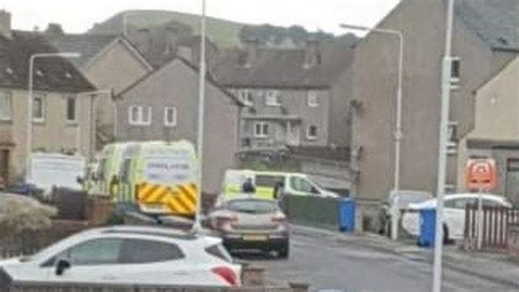 Riot police in flat raid as area taped off amid disturbance | STV News