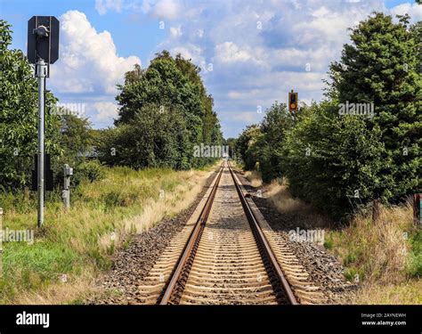 Old and abandoned railroad tracks in a northern european landscape ...