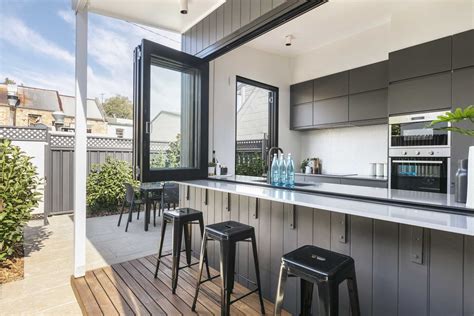 A Wall Of Bi-Fold Windows Open This Kitchen To The Outdoors – Architecture Collection