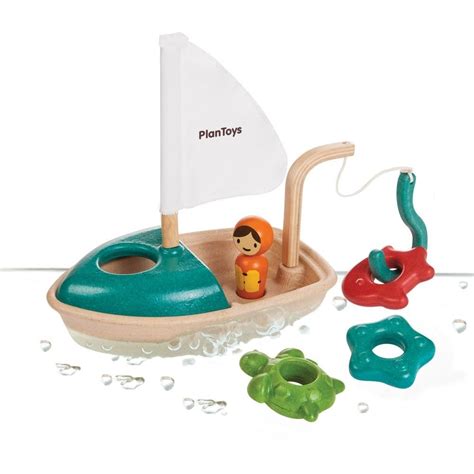 Gone fishin' with your first wooden toy fishing boat! The set includes a wooden boat with a ...