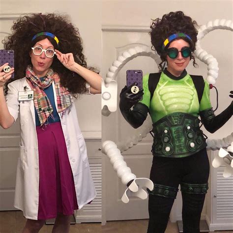 two women dressed in costumes holding up cell phones