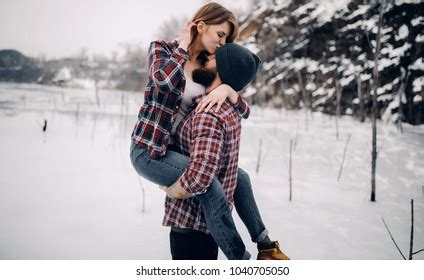 Young Couple Hugs Kisses During Winter Stock Photo 1040705050 | Shutterstock