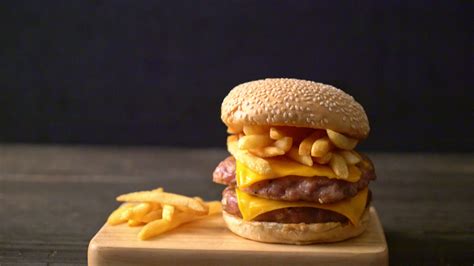 pork hamburger or pork burger with cheese, bacon and french fries 5857754 Stock Video at Vecteezy