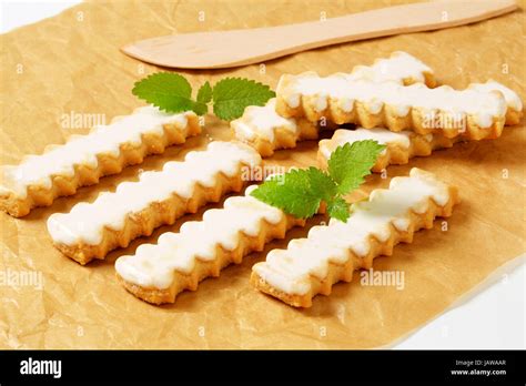 Vanilla cookies with white icing Stock Photo - Alamy